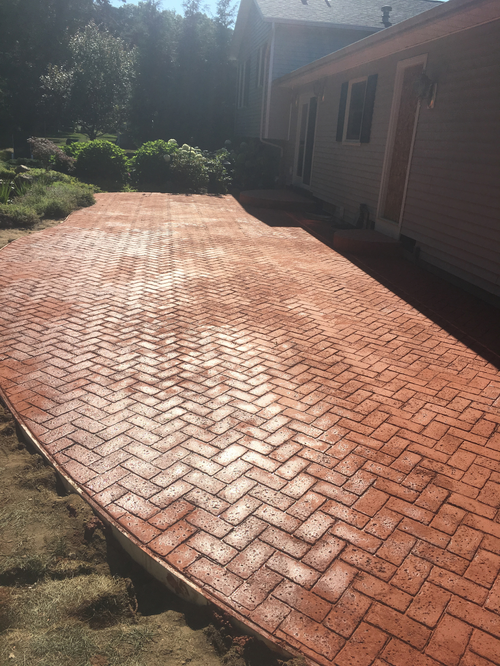 Brick texture, colored stamped concrete patio - uisconcretegr.com