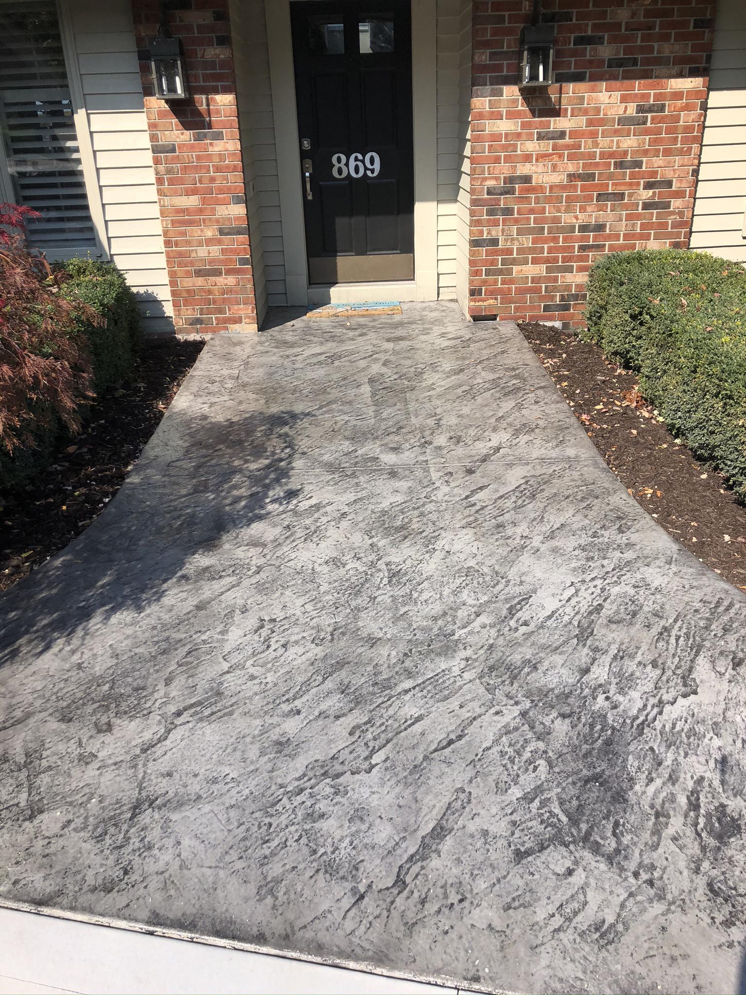 Stone texture stamped concrete sidewalk - uisconcretegr.com