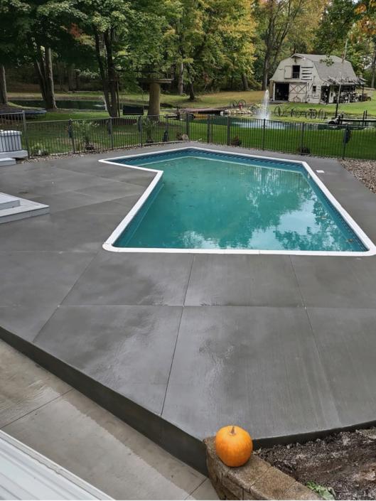 Swimming pool surrounds with concrete by UIS Concrete Company in Grand Rapids MI - uisconcretegr.com